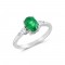 Emerald three-stone ring with pear shaped diamonds in 18k white gold
