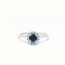 Halo cluster ring with blue sapphire and diamonds in 18k white gold