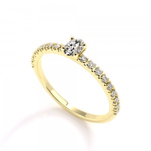 Μονόπετρο δαχτυλίδι με διαμάντι οβάλ 0.15ct και πέτρες στο πλάι από κίτρινο χρυσό Κ18